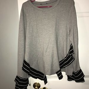 Gray long sleeved shirt with black and white trim